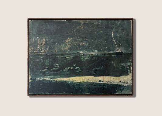 A framed abstract landscape painting featuring dark, textured brushstrokes of black, navy, and gray with a light beige horizontal band, set against a solid light beige background.