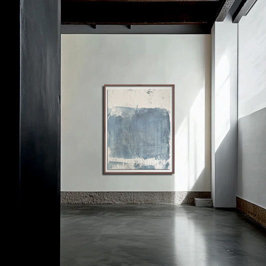 A framed abstract artwork hanging on a wall in a room with natural lighting.