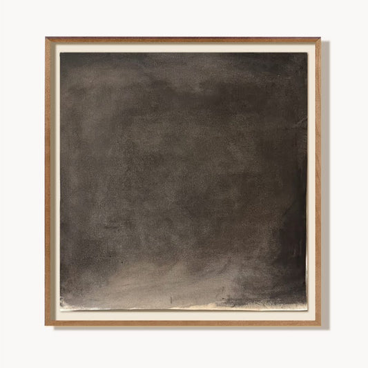 Abstract black painting in a wooden frame on a white background
