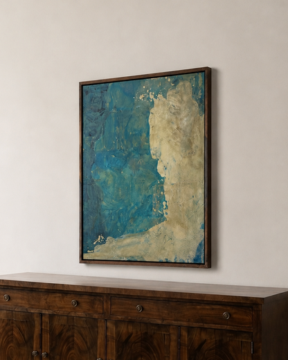 A dark wood sideboard cabinet with a matching wood top, positioned against a light beige wall on a parquet floor, beneath a framed abstract painting with blue and beige tones.