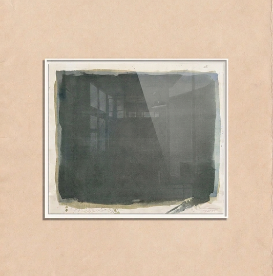 Framed black and white abstract artwork on a beige wall by makelberge