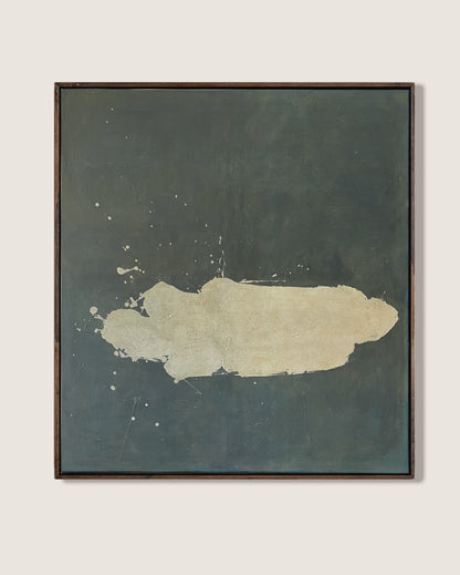 A framed abstract painting featuring a textured dark slate-green background with a central cream-colored brushstroke, displayed on a light beige wall.