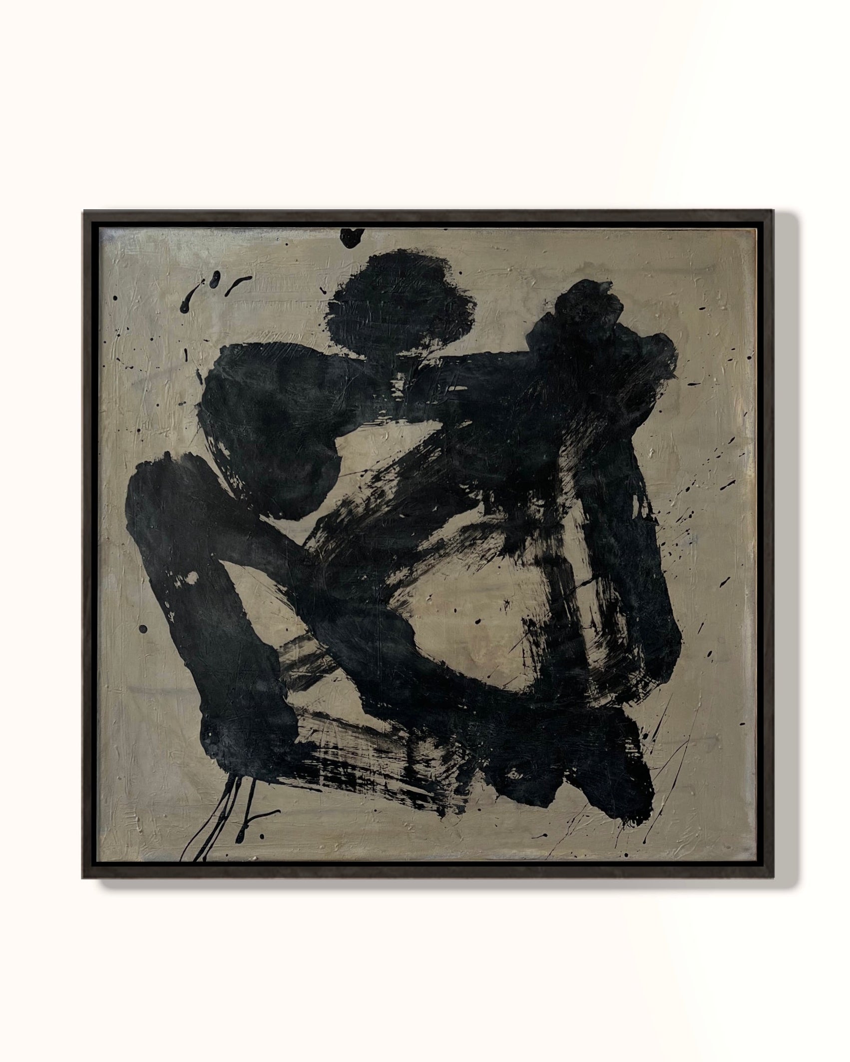 Abstract black artwork on a beige background