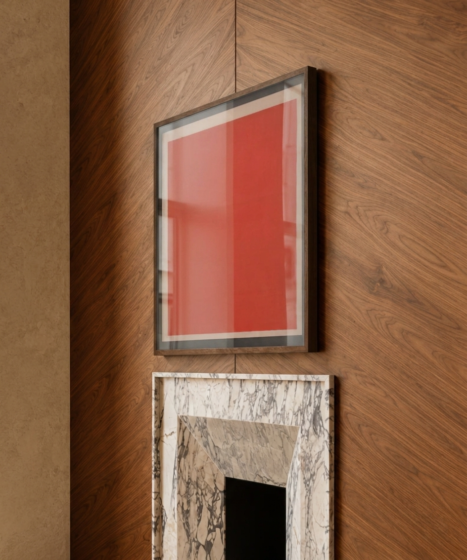 Framed makelberge abstract artwork with a red background on a wooden wall.
