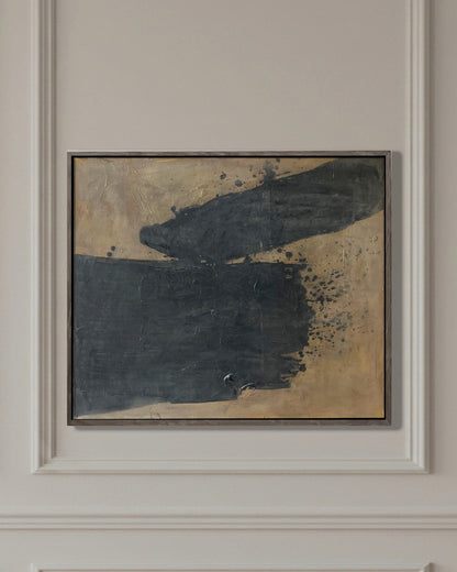 Abstract painting in a frame on a paneled wall