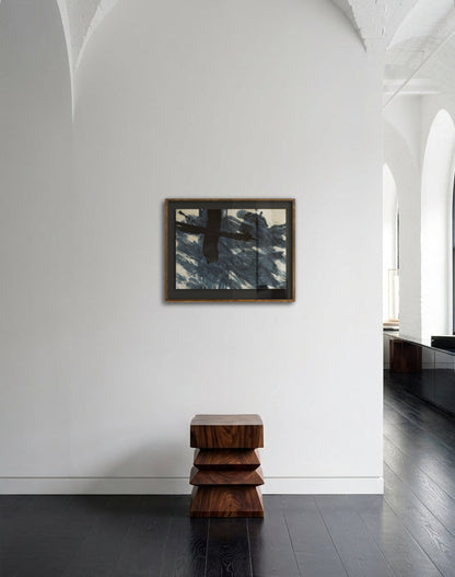 Modern interior with a stack of wooden stools against a white wall with a mirror.