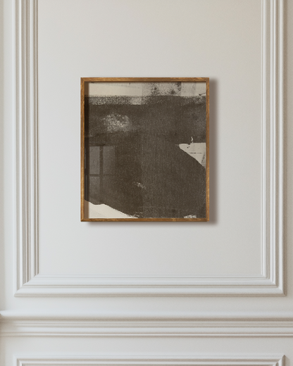 Framed artwork on a paneled wall