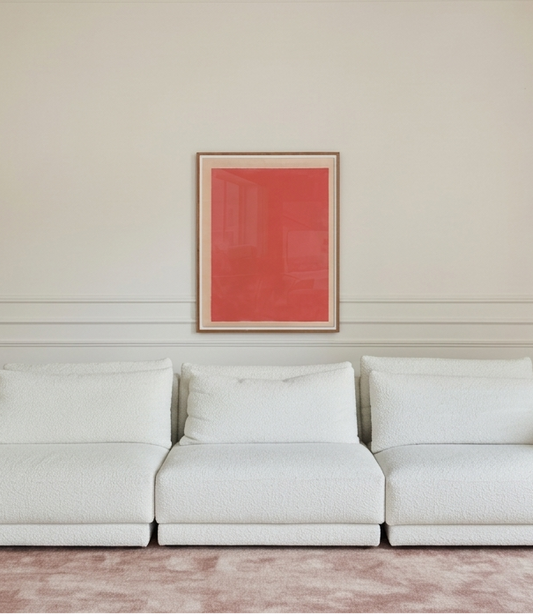 White sofa in a room with a red abstract painting on the wall.