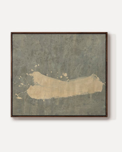A small square framed artwork centered on a plain light gray background. The artwork has a distressed textured surface in muted gray-green tones with a broad warm beige horizontal area across the middle.